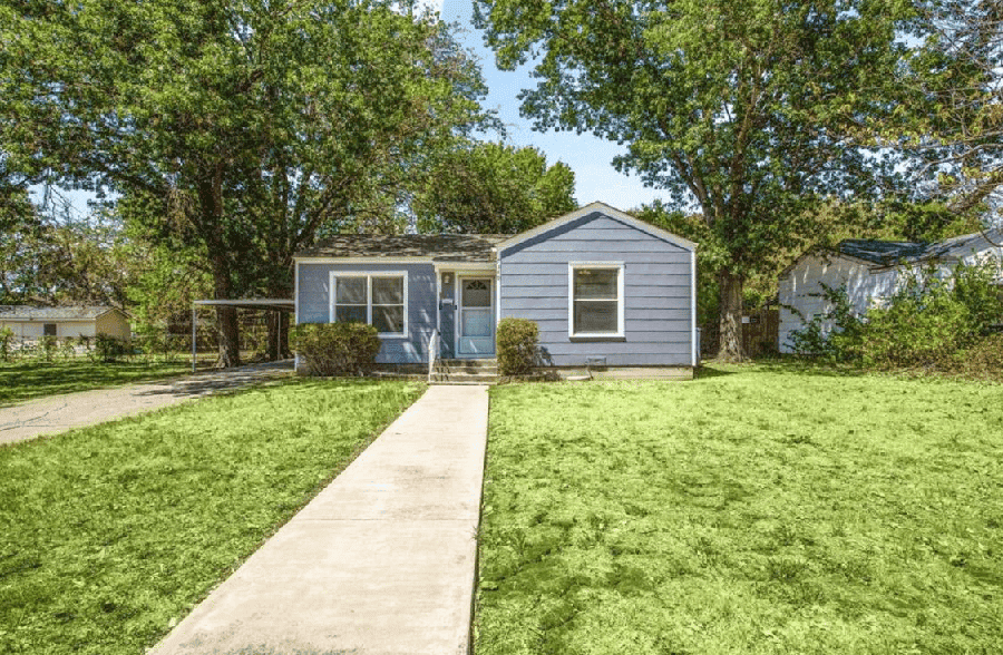 Compact home with a large lawn in Dallas, ideal for potential buyers or investors looking for homes in the area